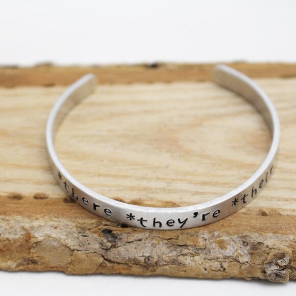 *There *They're *Their - Hand Stamped Anodized Aluminum Bangle - Adjustable - Picture 7 of 14